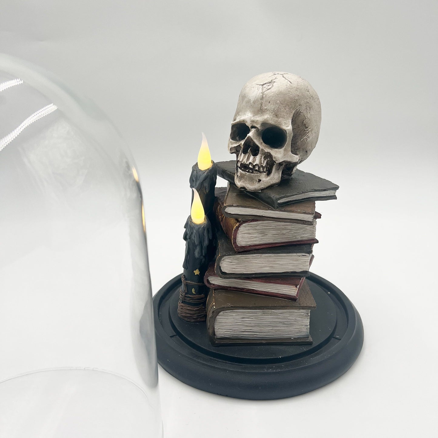 Cloche Skull on Books with LED Candles