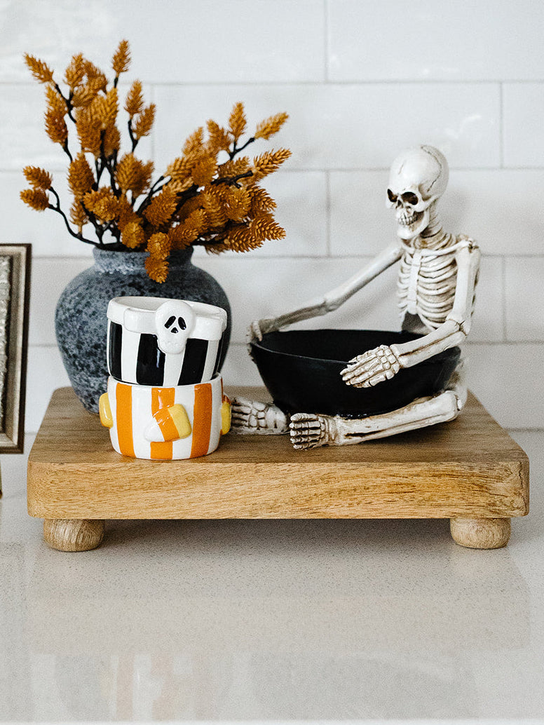 Sitting Skeleton Holding a Bowl -8"x6.75"x7.75"