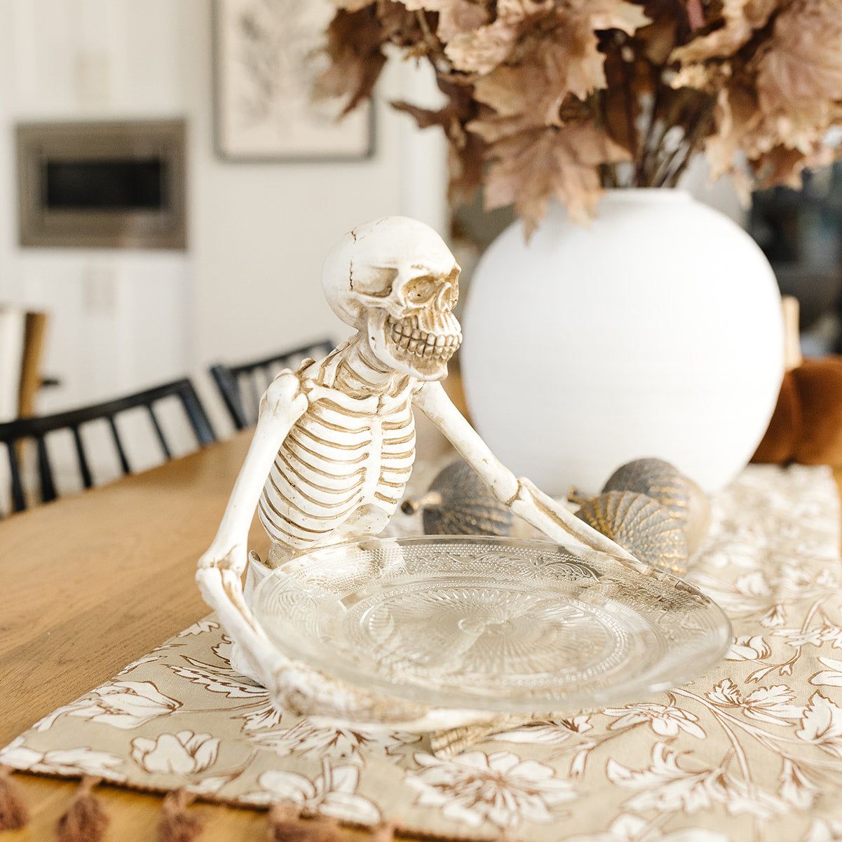 Sitting Skeleton Holding Glass Plate