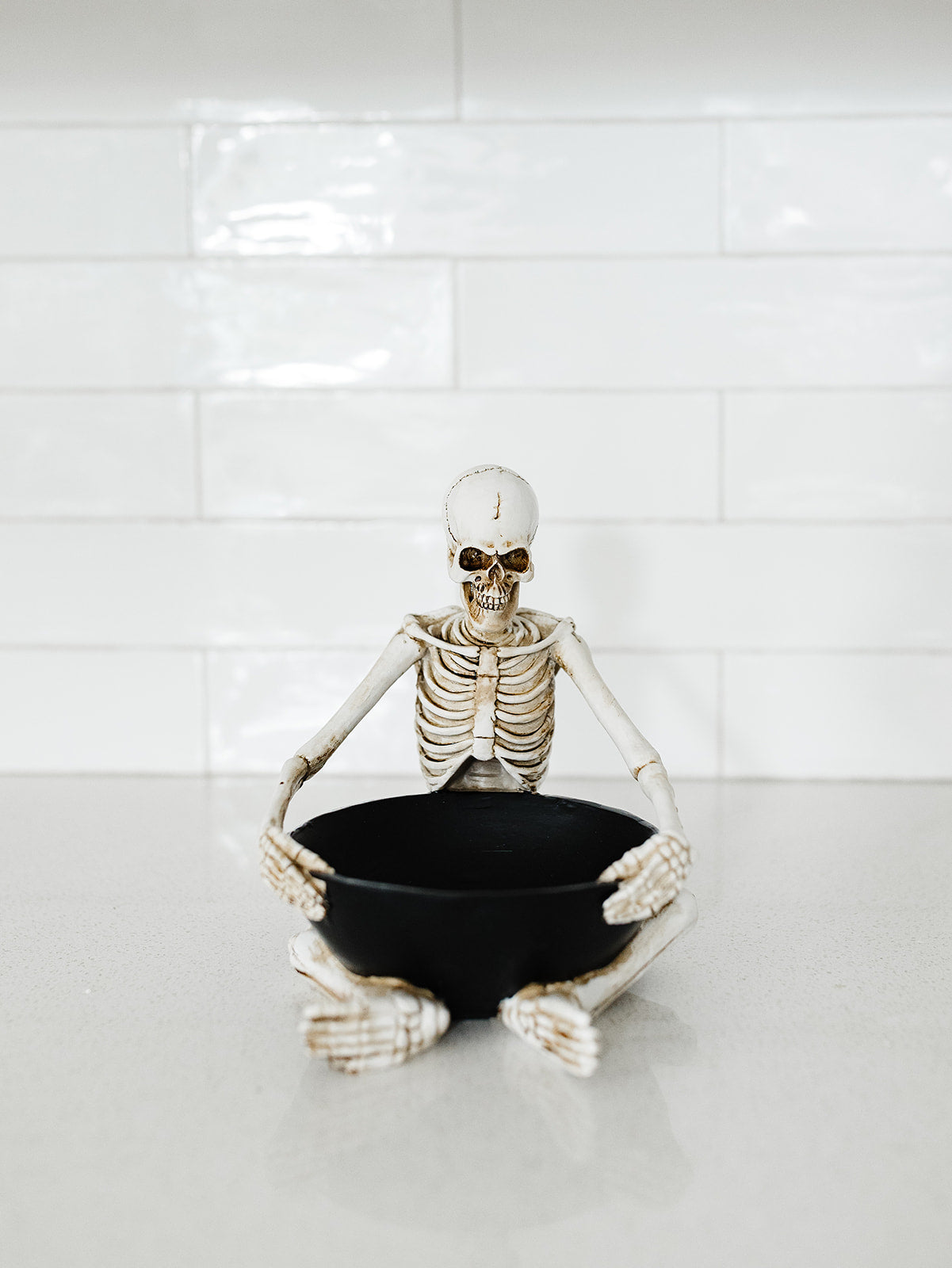 Sitting Skeleton Holding a Bowl -8"x6.75"x7.75"