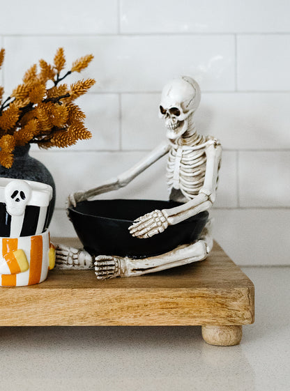 Sitting Skeleton Holding a Bowl -8"x6.75"x7.75"